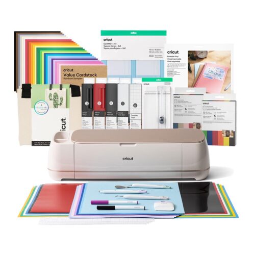 Cricut cutting machine with colorful papers vinyl and craft supplies arranged behind it for DIY projects
