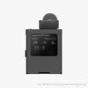 Dark gray 3D printer with a round filament spool mounted on top and a transparent front door viewed from the front left angle showing the build area inside