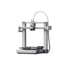Front view of a Bambu Lab 3D printer with a metal frame and touchscreen control panel on the base photographed from the side left