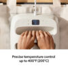 Two hands with rings rest on a white control device adjusting the settings as a digital display shows 400°F and 30 s precise temperature control