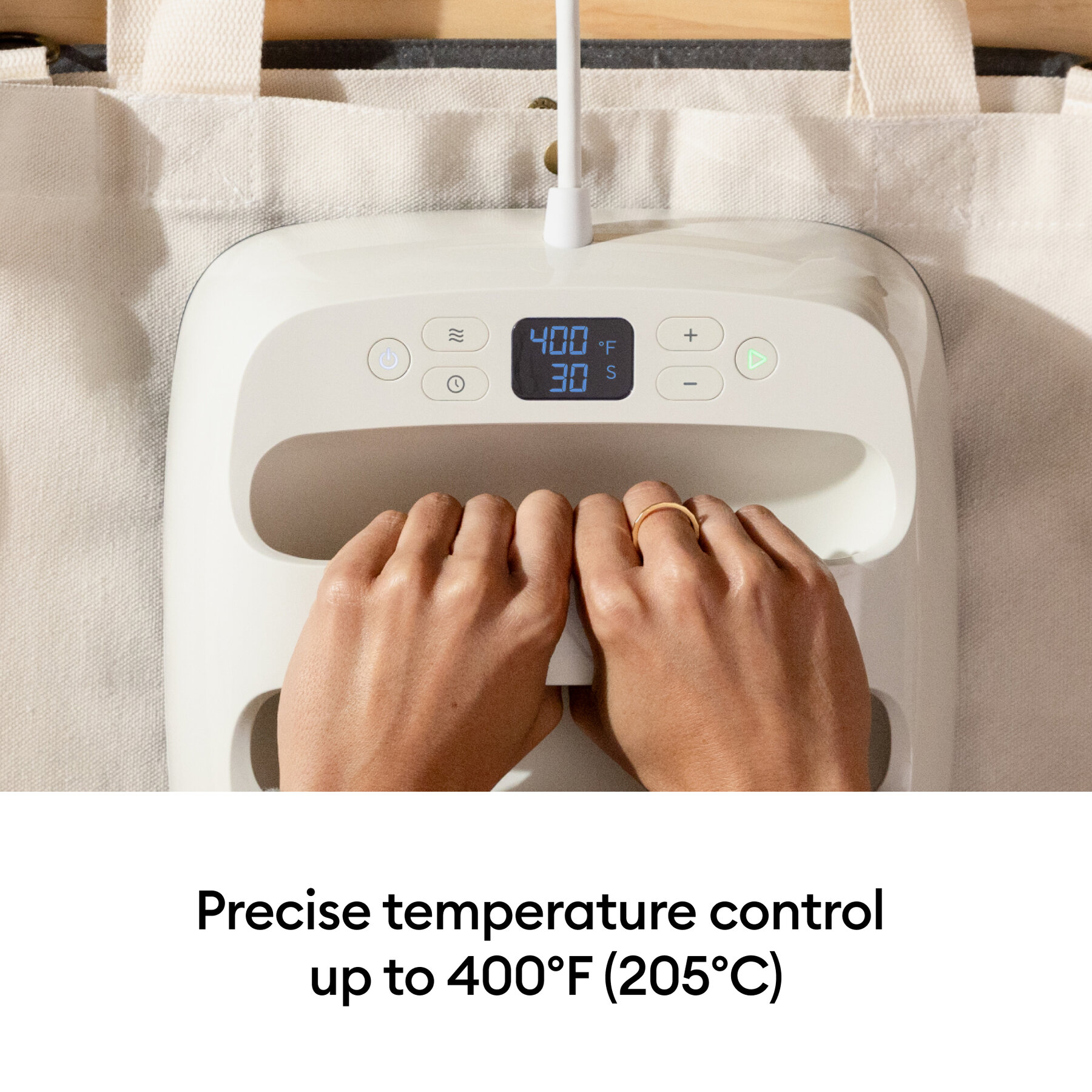 042012727infographic | Avloon Two hands with rings rest on a white control device adjusting the settings as a digital display shows 400°F and 30 s precise temperature control