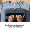 Hands on a heat press machine pressing a light blue shirt display shows 400°F and 30 seconds connected by a power cord