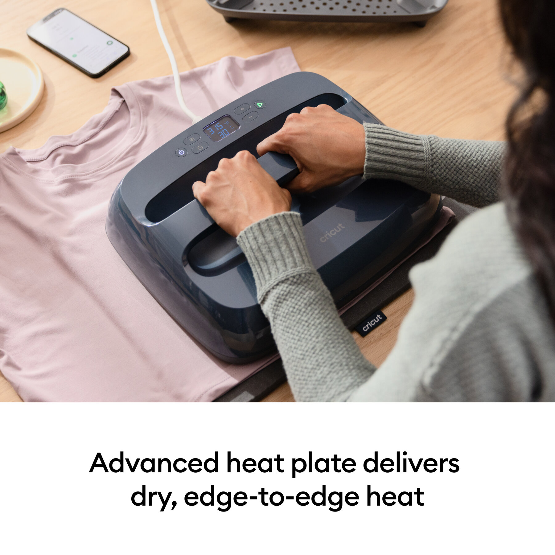 082012729infographic | Avloon Person using a Cricut heat press on a pink tshirt placed on a table