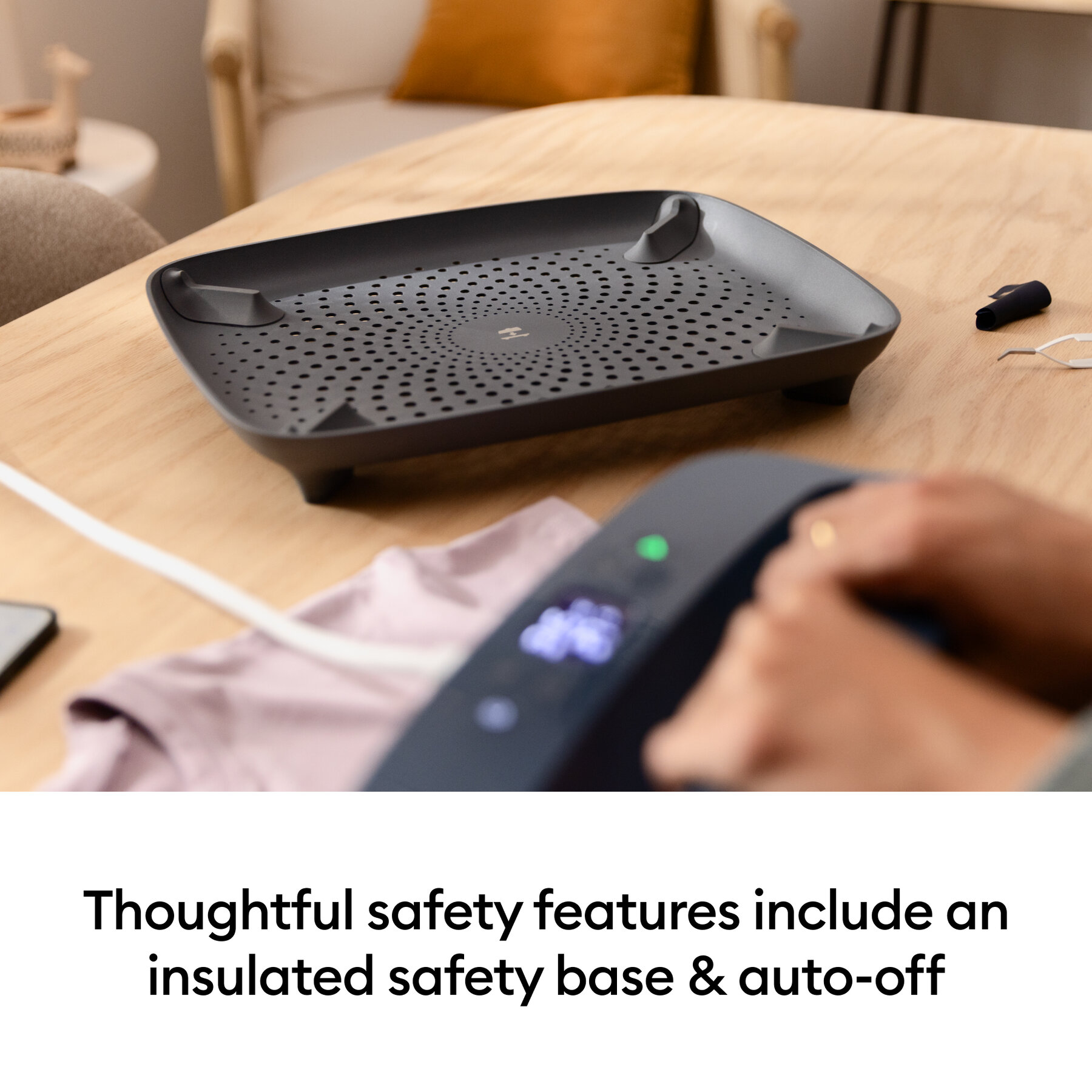 112012729infographic | Avloon Black perforated safety tray on a wooden table with a hand operating a nearby control device in the foreground